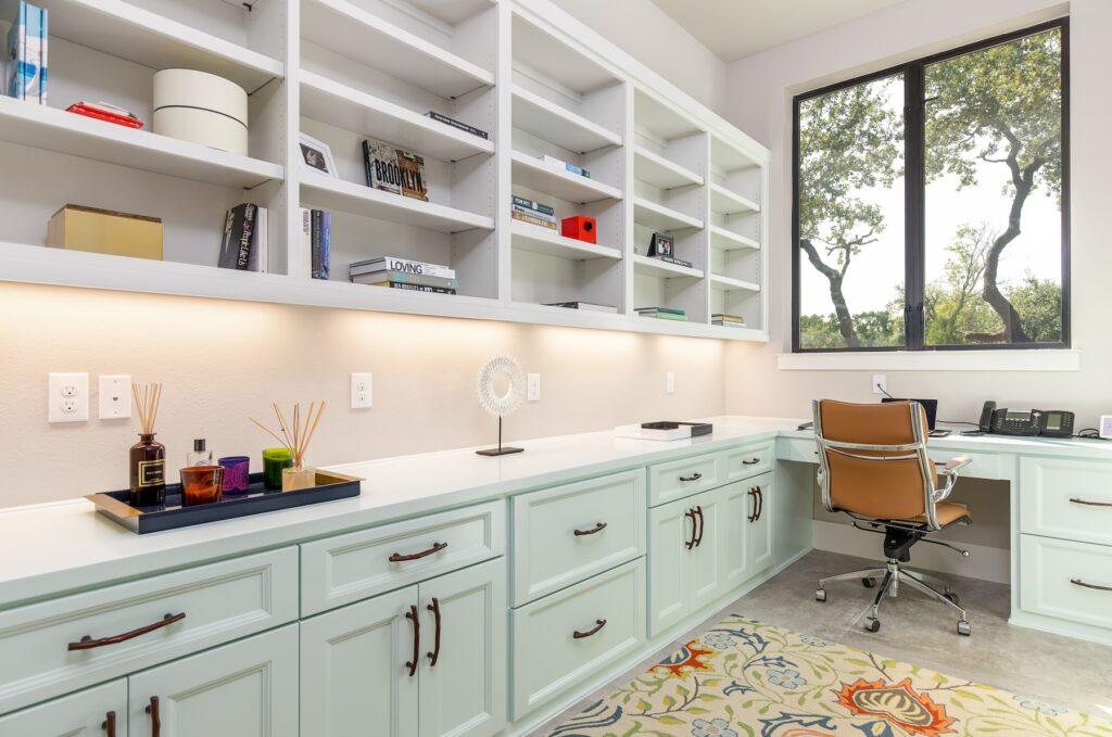 "Well-designed home office in San Antonio with ergonomic chair, organized desk, and natural lighting"