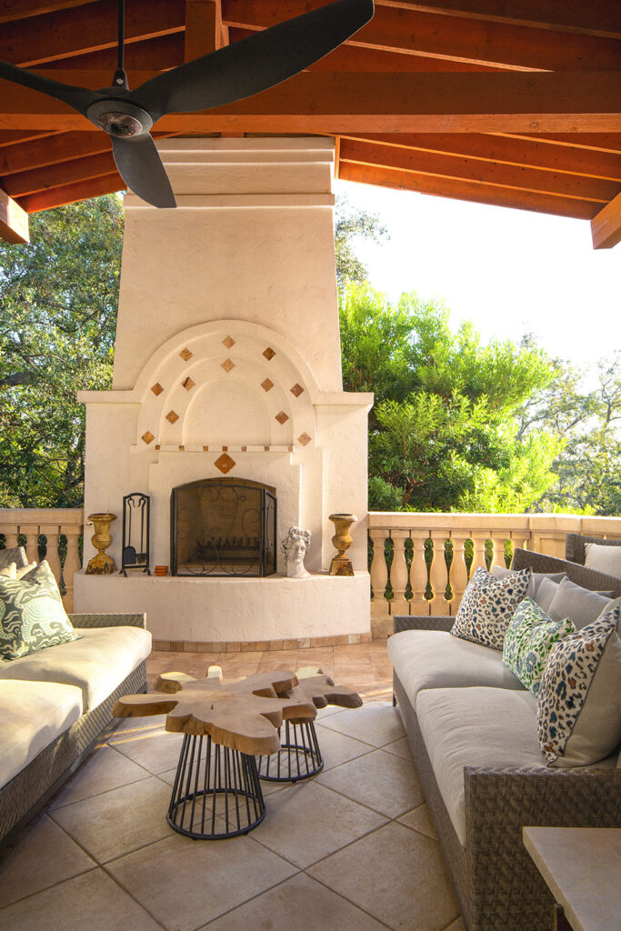 "Hand-plastered wall with warm earth tones and artisan crafted decor in Texas home"